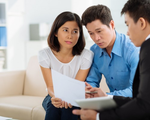 financial planners showing couple a financial plan