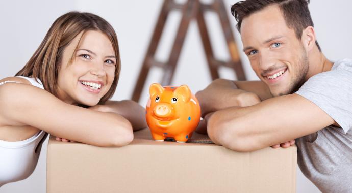 thinking about budgets couple with a piggy bank for budgeting